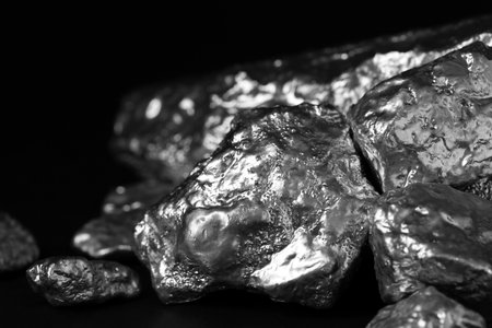 Pile of silver nuggets on black background, closeupの写真素材