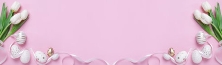 Flat lay composition with decorated Easter eggs and flowers on pink background, space for text....
