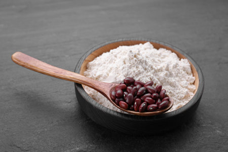 Kidney bean flour and seeds on black tableの写真素材