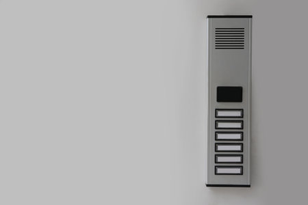 Modern intercom on white wall, space for text. security systemの写真素材