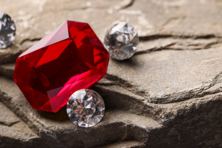 Beautiful gemstones for jewelry on stone surface, closeup. Space for textの写真素材