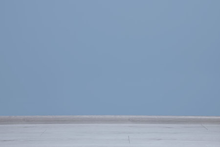 Beautiful light blue wall in clean empty room