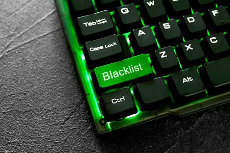 Green button with word Blacklist on computer keyboard, closeup
