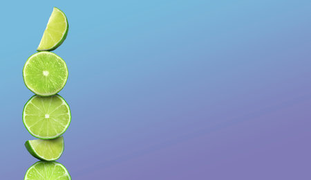 Stacked cut limes on color background, space for text