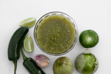Tasty salsa sauce and ingredients on white background, top viewの写真素材