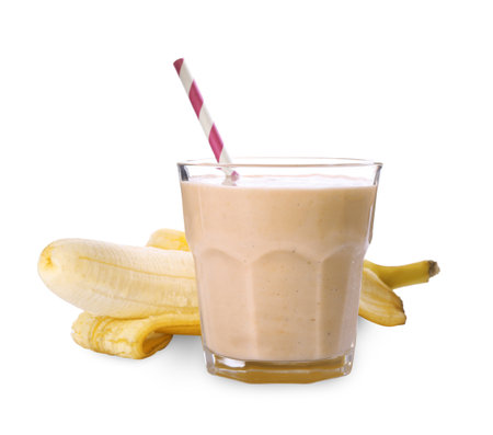 Glass of tasty banana smoothie with straw and fresh fruit on white backgroundの写真素材