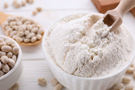 Kidney bean flour and seeds on white wooden table, closeupの写真素材