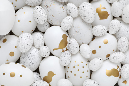 Many painted Easter eggs as background, top view