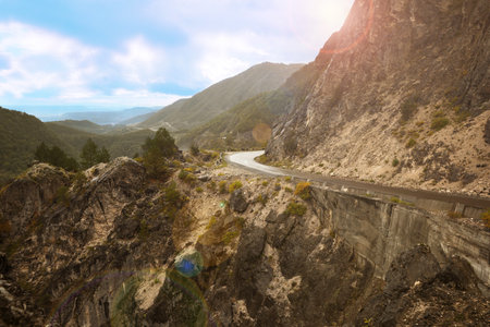 Picturesque view of empty road near mountains