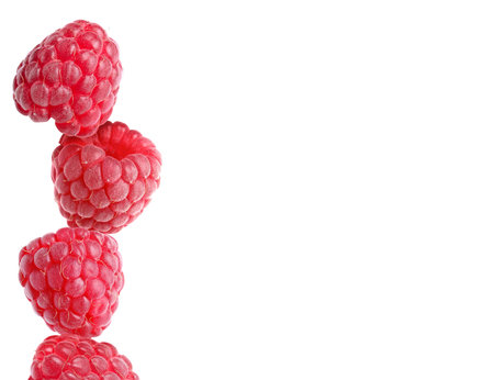 Stack of ripe raspberries on white background