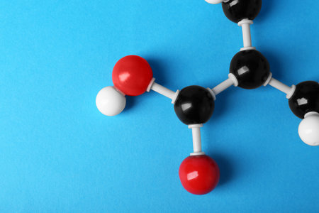 Molecule of vitamin B3 on light blue background, top view with space for text. Chemical modelの写真素材