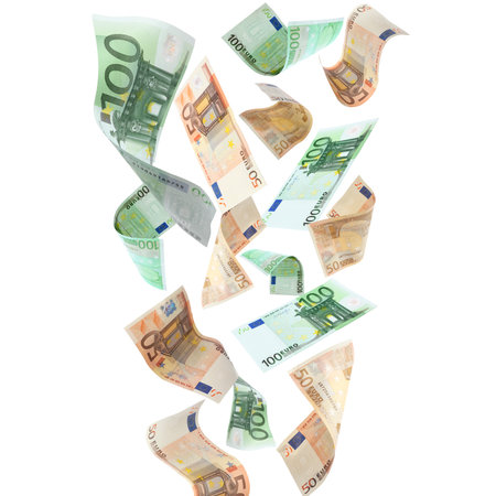 Many euro banknotes flying on white backgroundの写真素材