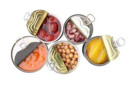 Open tin cans with different products on white background, top viewの写真素材