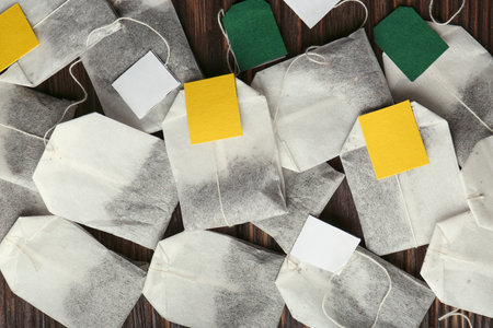 Tea bags on wooden table, flat layの写真素材