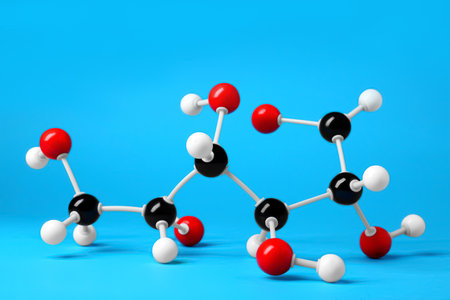 Molecule of glucose on light blue background. chemical modelの写真素材