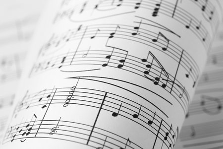 Sheets of paper with music notes as background, closeup viewの写真素材