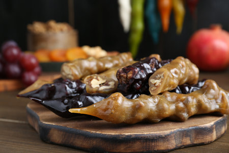 Many delicious sweet churchkhelas on wooden table, closeupの写真素材