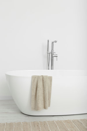 Beautiful white tub with towel in bathroom. Interior designの写真素材