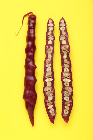 Delicious churchkhelas on yellow background, flat layの写真素材