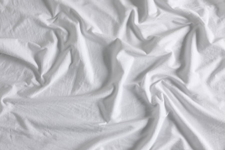 Crumpled white fabric as background, closeup viewの写真素材