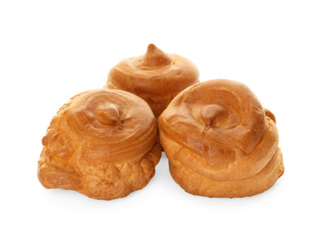 Pile of delicious profiteroles on white backgroundの写真素材