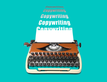 Words Copywriting going out of vintage typewriter on turquoise background