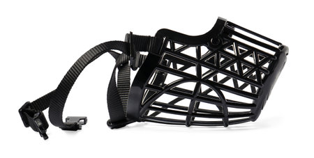 Black plastic dog muzzle isolated on white