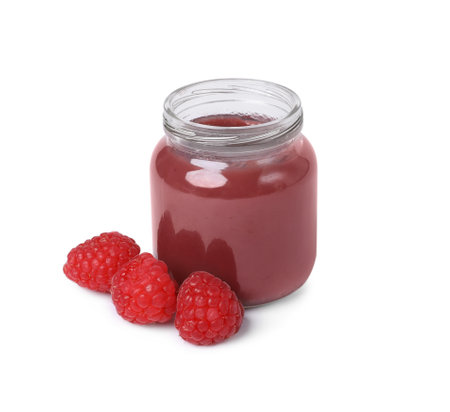 Jar of healthy baby food and fresh raspberries on white backgroundの写真素材