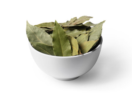 Aromatic bay leaves in bowl on white backgroundの写真素材