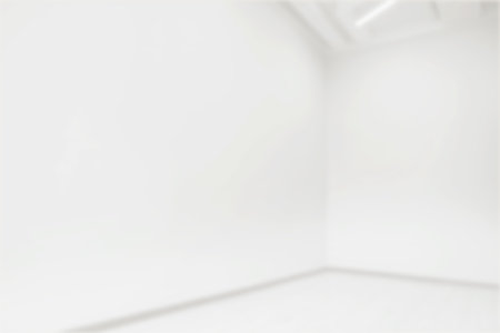 Empty room with white walls, blurred viewの写真素材
