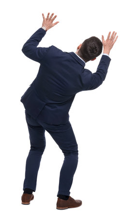 Businessman in suit on white background, back viewの写真素材