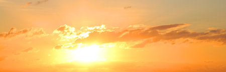 Sun shining on beautiful cloudy sky at sunset, banner design