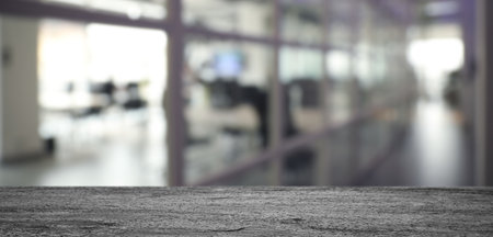 Empty black textured table in hall, banner. Space for designの写真素材