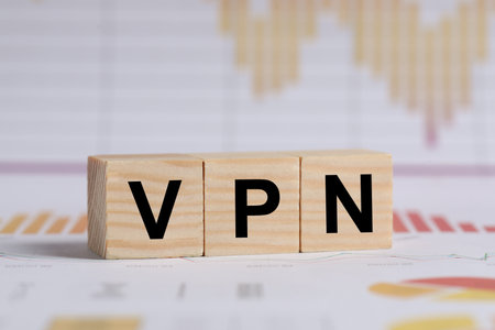 Acronym VPN (Virtual Private Network) made of wooden cubes on documentの写真素材