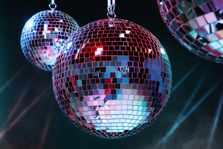 Bright shiny disco balls on dark backgroundの写真素材