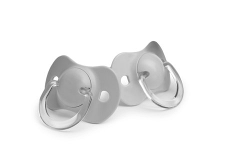 New gray baby pacifiers isolated on white