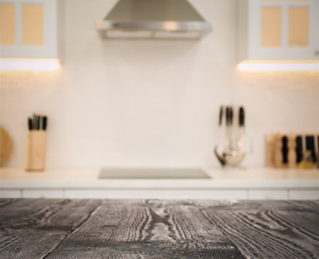Empty wooden table in beautiful kitchen. Space for designの写真素材