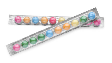 Packages with many bright gumballs isolated on white, top view