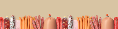 Many different tasty sausages on beige background, flat lay. Banner design