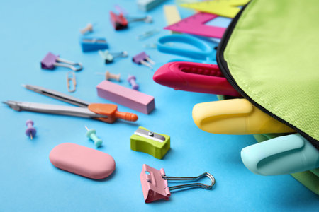 Back to school. Many different school stationery on light blue backgroundの写真素材