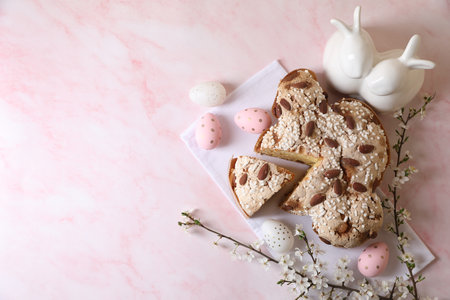 Delicious Italian Easter dove cake (traditional Colomba di Pasqua), painted eggs, figure of rabbits...