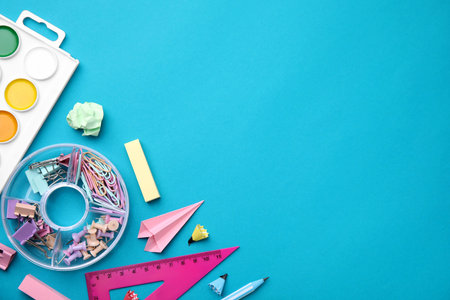 Different school stationery items on light blue background, flat lay with space for text. Back to schoolの写真素材