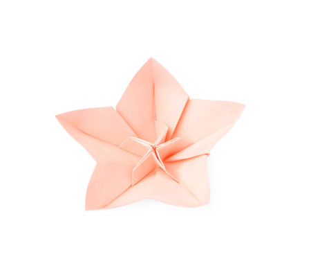 Origami art. Handmade pink paper flower on white backgroundの写真素材