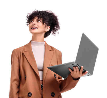 Beautiful happy businesswoman with laptop on white background, low angle viewの写真素材