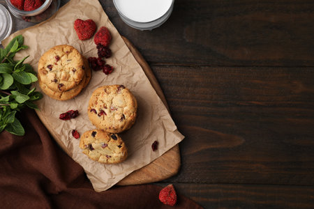 Cookies with freeze dried fruits and mint on wooden table, flat lay. Space for textの写真素材