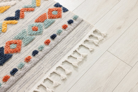 Carpet with beautiful pattern on floor, space for text