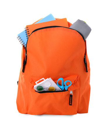 Stylish backpack with school stationery on white backgroundの写真素材