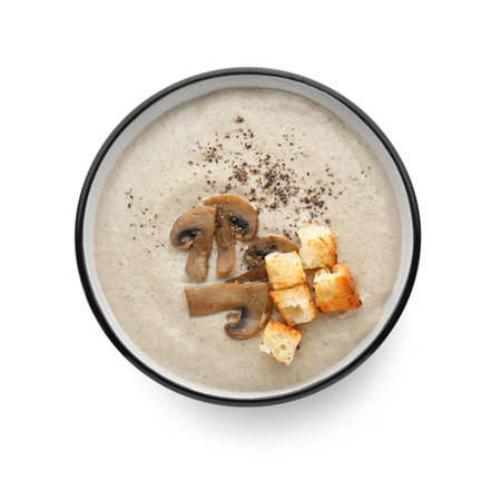 Delicious cream soup with mushrooms and croutons on white background, top viewの写真素材
