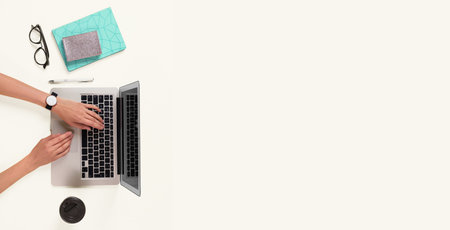 Woman using modern laptop on white background, top view. Banner design with space for text