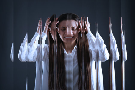 Woman suffering from paranoia on dark background, glitch effectの写真素材